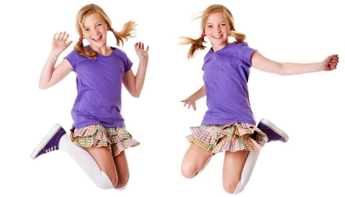 Identical Twin Girls Jumping