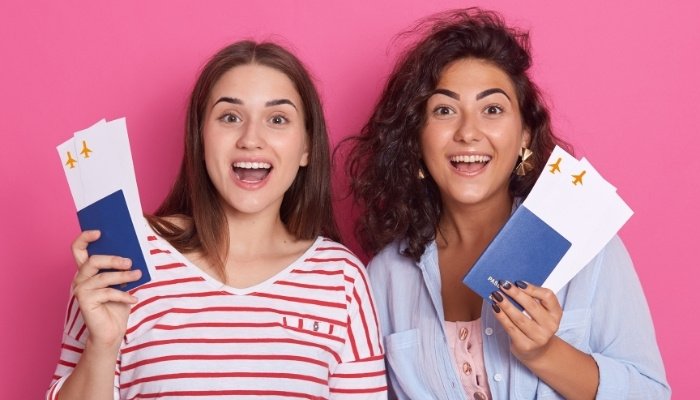 Twin Girls Holding Their Passports
