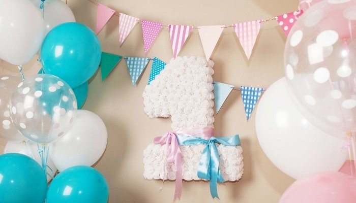 Balloons and decorations for twins' first birthday.