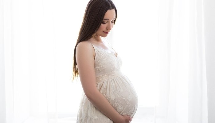 Petite Woman Carrying Twins