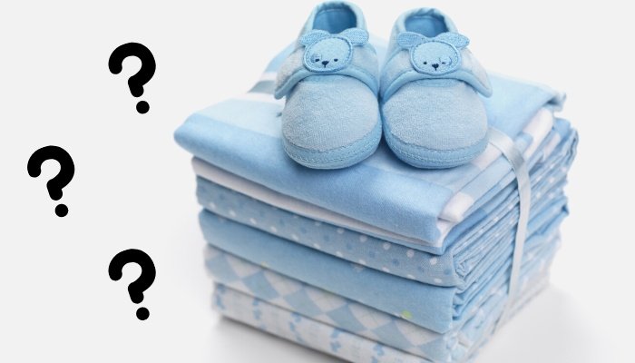 A stack of swaddling blankets with a pair of baby shoes on top with question marks off to the side.