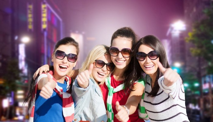 A group of four women having fun during a night on the town.