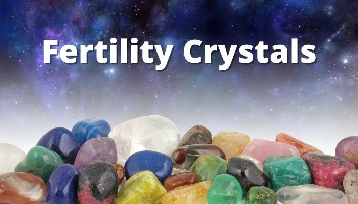 An assortment of healing crystals and gemstones on a cosmic background.