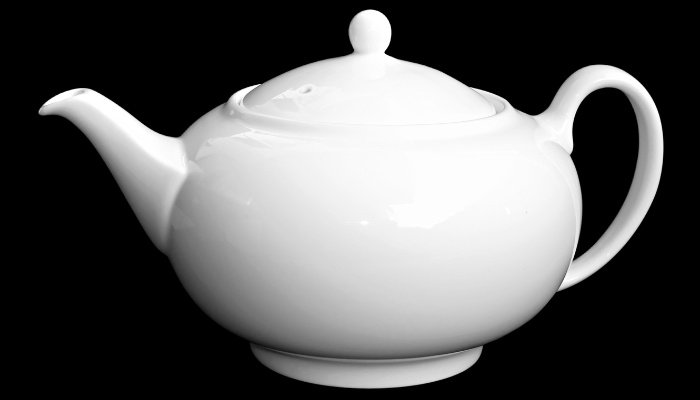 A classic white teapot on a black background.