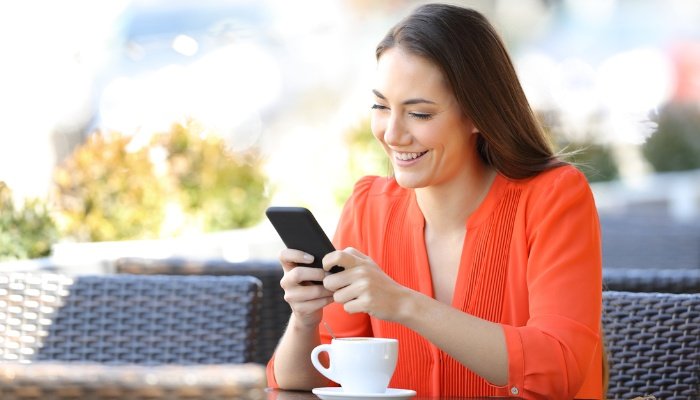A young woman enjoying some quiet time and relaxation at a coffee shop.